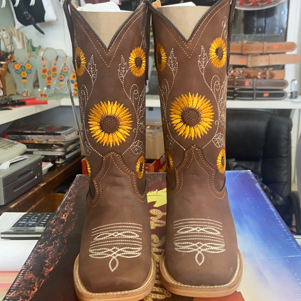 Brown colored western squaretoed boots